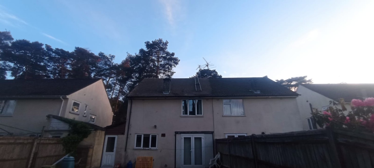 Roof cleaning work in progress — moss and algae removal Hampshire
