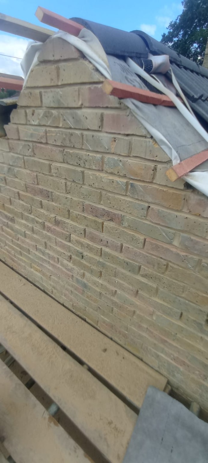 Ridge tile rebedding and repair work on residential roof Tadley