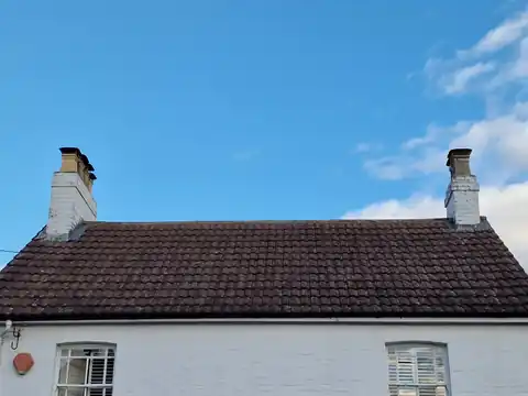 Cottage roof after moss removal and treatment in Hampshire